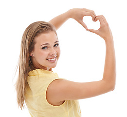 Image showing Woman, portrait and heart hands for love in studio, kindness and peace emoji or symbol. Happy female person, support icon and smiling on white background, romance emoticon and feedback or review