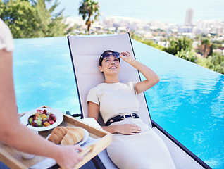 Image showing Hotel, pool and woman with luxury breakfast for business trip, smile and relax with rooftop service. Travel, hospitality and happy businesswoman on lounge chair for brunch, sunshine and villa holiday