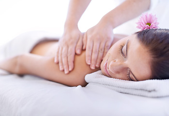 Image showing Relax, massage and woman at hotel spa with flower for health, wellness and luxury holistic treatment. Self care, peace and girl on table with masseuse for body therapy, sleep and calm service.