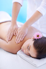 Image showing Relax, massage and woman at hotel pool with flower for health, wellness and luxury holistic treatment. Self care, peace and girl on table with masseuse for body therapy, sleep and calm spa service