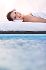 Image showing Massage, portrait and woman at spa poolside for health, wellness and luxury holistic treatment. Self care, peace and face of girl on pool bed for body therapy, comfort and calm hotel service to relax