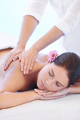 Image showing Calm, massage and woman at wellness spa with flower for health, relax and luxury holistic treatment. Self care, peace and girl on table with masseuse for body therapy, balance and hotel service.