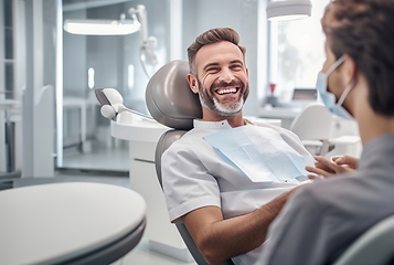 Image showing Smiling man in dental chair for a modern check-up