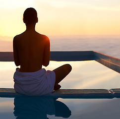 Image showing Rear view, yoga and meditation of woman at sunset by swimming pool for healthy body, wellness and zen outdoor on mockup space. Back, mindfulness or person by water at twilight to relax, peace or calm