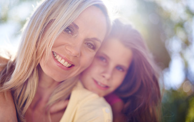 Image showing Mother, girl child and portrait outdoor with happiness for bonding, support or hug on holiday in nature. Family, woman and daughter with face, smile or embrace on vacation, travel and love with bokeh