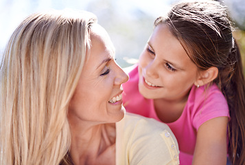 Image showing Mother, girl child and happiness outdoor with bonding for support, hug and trust on holiday in nature. Family, woman and daughter with face, smile and embrace on vacation, travel and love with fun