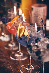 Image showing Elegant gin and tonic cocktails with blueberries