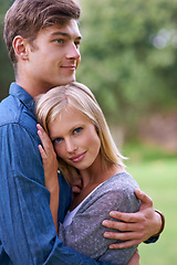 Image showing Man, woman and hug with portrait in garden, park and happy for care, bonding and love in spring. Couple, people and embrace with connection in by grass lawn with smile for relationship in Los Angeles