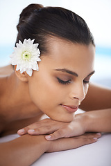 Image showing Woman, massage and spa treatment for relaxing, wellness and beauty therapy for body care. Organic skincare, calm and serene or female person on bed, tranquil and resting at resort and peace or zen