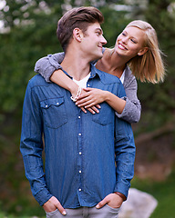 Image showing Couple, portrait and smile with hug in nature or countryside for holiday, vacation or anniversary getaway. Love, man and woman with face, happy and embrace in woods or forest for relationship or care