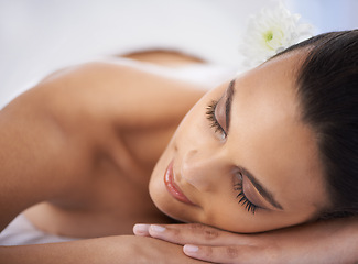 Image showing Relax, nap and woman at spa with self care, wellness and luxury skin treatment for zen. Calm, cosmetics and young female person with beauty body routine sleeping on towel at health salon for peace.