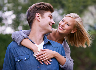 Image showing Couple, portrait and happy with hug outdoor in countryside for holiday, vacation and anniversary getaway. Love, man and woman with face, smile and embrace in woods or forest for relationship or care