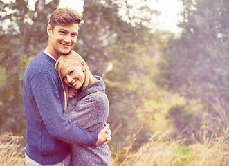 Image showing Portrait, couple and hug with countryside space for love, romance or bonding in summer environment. Smile, safety or security with young man and woman embracing outdoor in nature for happy hiking