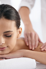 Image showing Relax, woman and hands massage shoulder for skincare, beauty and pampering body for wellness at luxury salon. Therapist, table and person at spa for treatment, peace and calm for health with masseuse