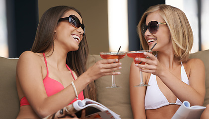 Image showing Friends, women and toasting with alcohol at hotel, celebration and drinking wine on tropical vacation. People, happy and cheers with cocktail on summer holiday, weekend trip and travel to resort