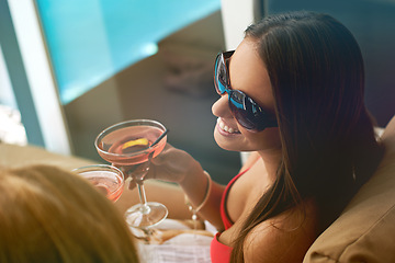Image showing Women, friends and cocktail at swimming pool for summer party with alcohol for relax, sunshine or vacation. Female people, drinks and cheers on patio in Miami for bikini holiday, bonding or weekend