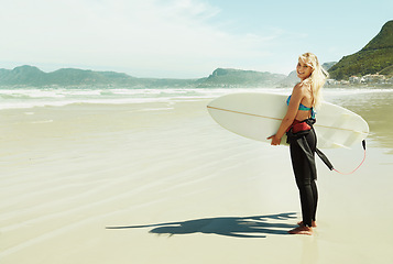 Image showing Portrait, smile and woman with surfboard at beach on space for sports, travel or hobby in summer. Fitness, surfing and vacation with happy young person on tropical coast for holiday or island getaway