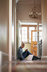 Image showing Woman, drink or laptop on floor for remote work and internet connection for information. Freelancer, relax or female editor on website for research or online news or typing an article on technology