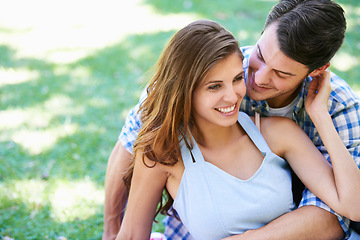 Image showing Man, woman and embrace on grass in park for holiday bonding in summer for relax, partnership or love. Happy couple, hug and ground in backyard garden in nature for vacation date, lawn or sunshine