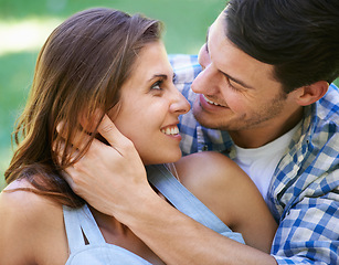 Image showing Man, woman and smile with embrace in park for holiday vacation or relationship connection, bonding or summer. Happy couple, hug and love in backyard garden for marriage care, together or partnership