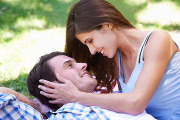 Image showing Man, woman and relax on grass in park for holiday in summer bonding or weekend, happiness or outdoor. Happy couple, smile and embrace on lawn or together for dating connection or rest, love or London