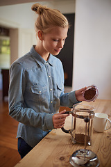 Image showing Woman, coffee and french press in kitchen or prepare with plunger for morning beverage, caffeine or drinking. Female person, counter and breakfast equipment with mug for espresso, cappuccino or home