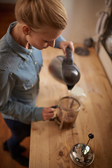 Image showing Woman, coffee and french press our pour water from kettle in kitchen for morning, beverage or preparation. Female person, plunger and counter from above in apartment or caffeine, espresso or drink