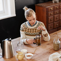 Image showing Woman, happy and herbal tea for wellness in home and warm beverage of herbs mixture for health. Kitchen, lady and detox with dry leaves in plunger and chamomile drink to relax in apartment in above