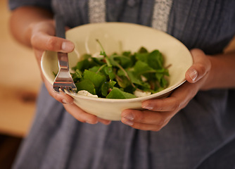 Image showing Hands, salad bowl and lettuce for healthy nutrition with vegetables in kitchen or recipe, wellness or hungry. Person, fingers and fork for organic eating or leafy greens for ingredients, dish or meal