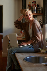 Image showing Woman, kitchen and laptop with smile, portrait and for learning, internet or email. Happy influencer, technology and research for blog, payment or registration for planning, working or accounting