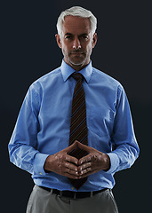 Image showing Senior, businessman and portrait or serious in studio with confidence and pride for corporate career or job. Mature, entrepreneur and ceo with face, thoughtful and contemplating on black background