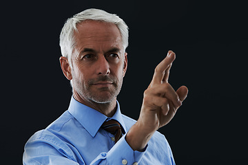 Image showing Business man, finger and future interface for choice isolated on a black studio background. Touch, professional and hand gesture on screen, click button and innovation of technology for senior CEO