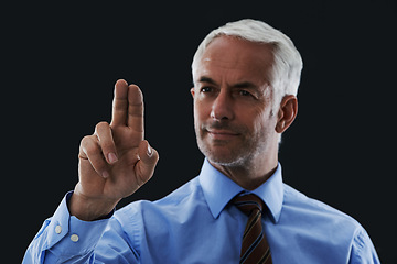 Image showing Business man, finger and press interface for choice isolated on a black studio background. Touch, professional and hand gesture on screen, click and future innovation of technology for senior CEO