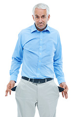 Image showing Businessman, portrait and empty pocket in studio or bankrupt or no money for financial crisis, unemployment or fail. Male person, face and economic problem with poverty, white background or mockup