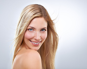 Image showing Beauty, hair and portrait of woman in studio with natural makeup, smile and straight hairstyle. Haircare, cosmetics and happy model with keratin growth, wind and face of girl on white background.