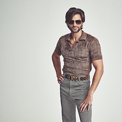 Image showing Man, portrait and retro fashion in studio for vintage look, sunglasses and unique trendy clothes for old school feel. Confident, person and comic display for different style, weird and mockup space