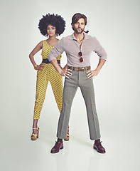 Image showing Couple, portrait and fashion in confidence with pipe for smoking, style or outfit on a gray studio background. Interracial man, woman or smoker in stylish retro and vintage pants, shirt or jumpsuit