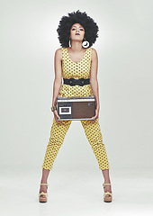 Image showing Black woman, fashion in studio with radio in jumpsuit, white background, afro and vintage. Colour, attitude and trendy with style in fancy clothes, heels and beauty with confidence and retro