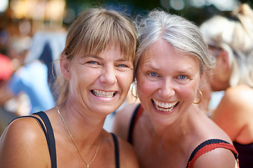 Image showing Portrait, women and happy friends at festival outdoor, bonding and having fun together at celebration in summer. Face, smile and group of mature people laughing at party, carnival and social event