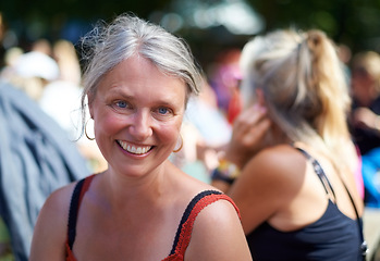 Image showing Portrait, smile and mature woman at music festival outdoor, event or social gathering. Face, happy and senior person at party, carnival or concert with positive expression for celebration in Denmark