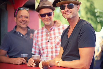 Image showing Outdoor, portrait and men with drinks at concert, event or music festival on summer day in Germany. Happy, male friends or brothers with alcoholic beverages for bonding, party or Oktoberfest