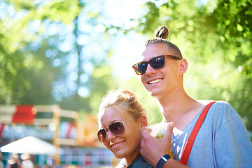 Image showing Sunglasses, smile and couple at music festival outdoor, event and celebration on valentines day together in summer. Face, man and happy woman at party, carnival and date in nature with drink at park