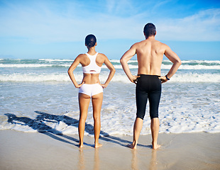 Image showing Couple, sea and fitness with swimming, training and exercise for race in summer by the beach. Back, athlete and workout of people by the ocean in Miami for health and wellness outdoor for sport