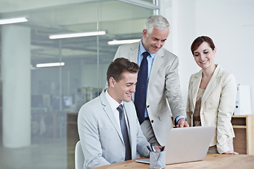 Image showing Laptop, meeting and business people in office for research on corporate legal project in collaboration. Team, technology and group of attorneys work on law case with computer in workplace boardroom.