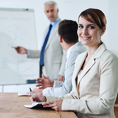 Image showing Meeting, presentation and business woman in portrait, notes for planning with collaboration or corporate training session. Seminar, information and CEO with whiteboard, smile for team and strategy