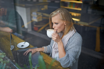 Image showing Coffee shop, laptop and woman with drink in window online for internet, website and research. Restaurant, cafe and person on computer for freelance career, remote work and email with cappuccino