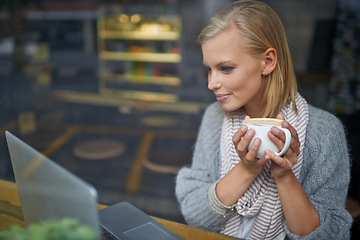 Image showing Coffee shop, laptop and woman online for remote work in window for internet blog, website and research. Restaurant, relax and girl on computer for freelance career, working and email with cappuccino