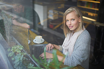 Image showing Coffee shop, laptop and portrait of woman typing in restaurant online for internet, website and research. Happy, relax and girl on computer for freelance career, remote work and email with cappuccino