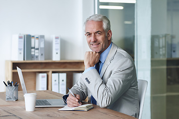 Image showing Senior, businessman and smile, laptop and portrait at desk in the office for consultation. CEO, man and plan for budget, payroll and human resources and writing in company for startup proposal