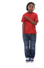 Image showing Child, pointing and smile for advertising and announcement with comedy in a studio. Happy, showing and emoji hand gesture of African male boy with casual fashion with direction and white background